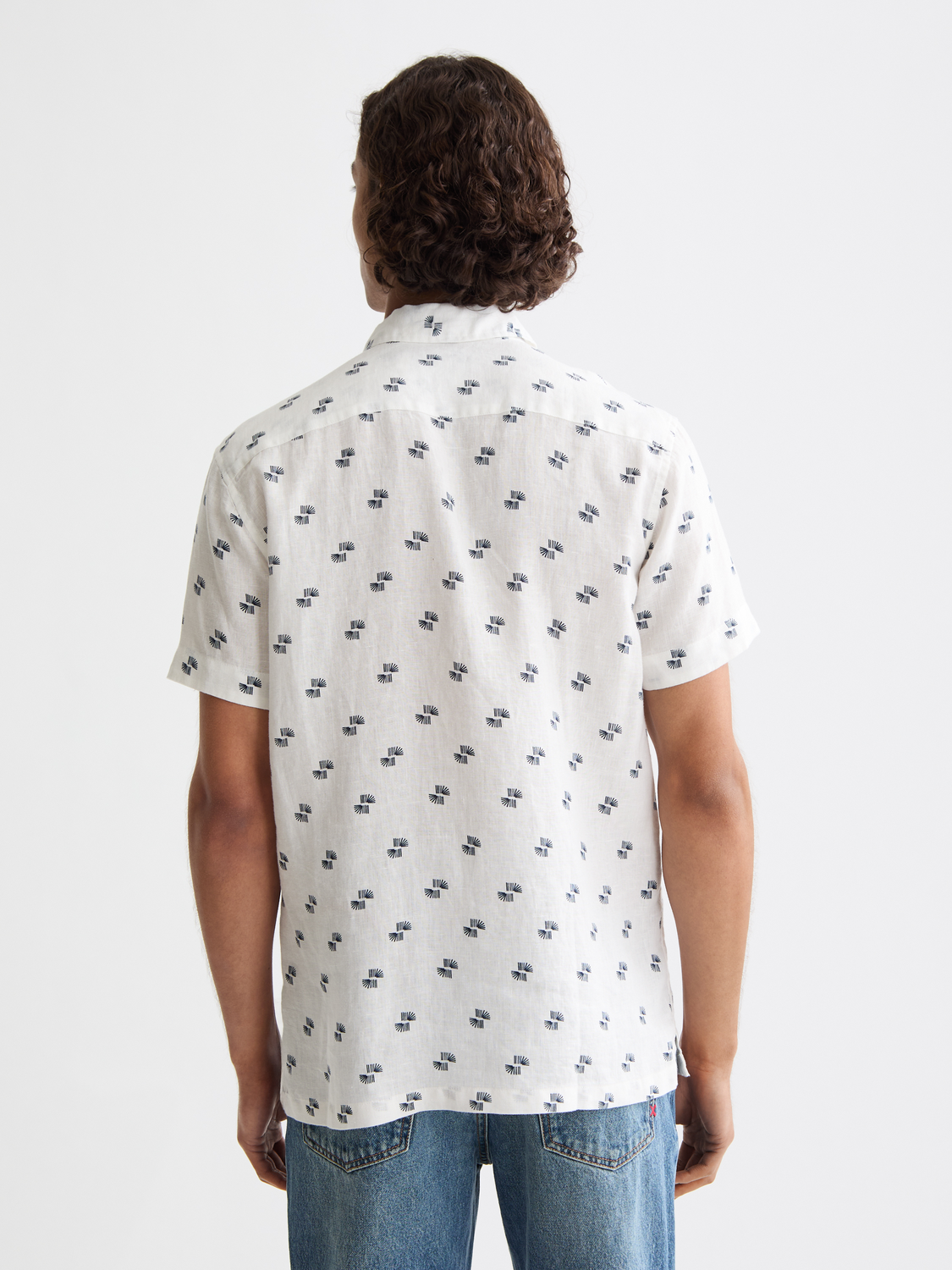 Short sleeve printed shirt from Scotch & Soda with a colorful, patterned design, shown from the back.