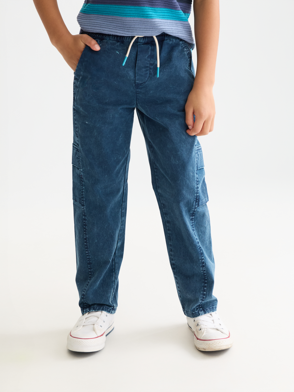 Kids' garment-dyed pants by Scotch & Soda, soft cotton fabric, featuring comfortable fit and stylish design.