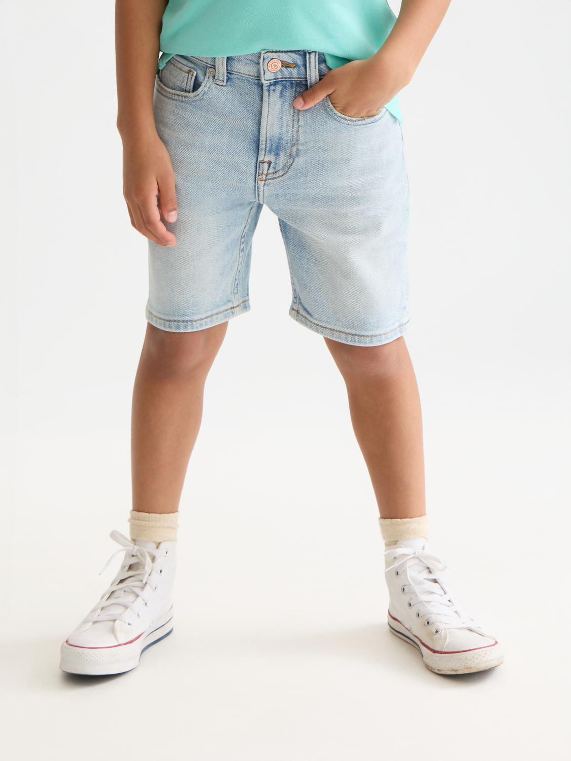 Kids' denim shorts by Scotch & Soda, loose-fit pitch shorts in classic blue denim, front view showing casual style.