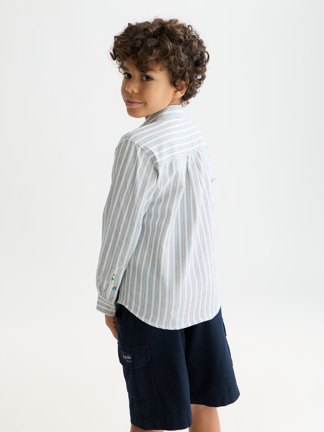 Kids striped linen long-sleeve shirt by Scotch & Soda, displayed with the back view showing blue and white stripes.