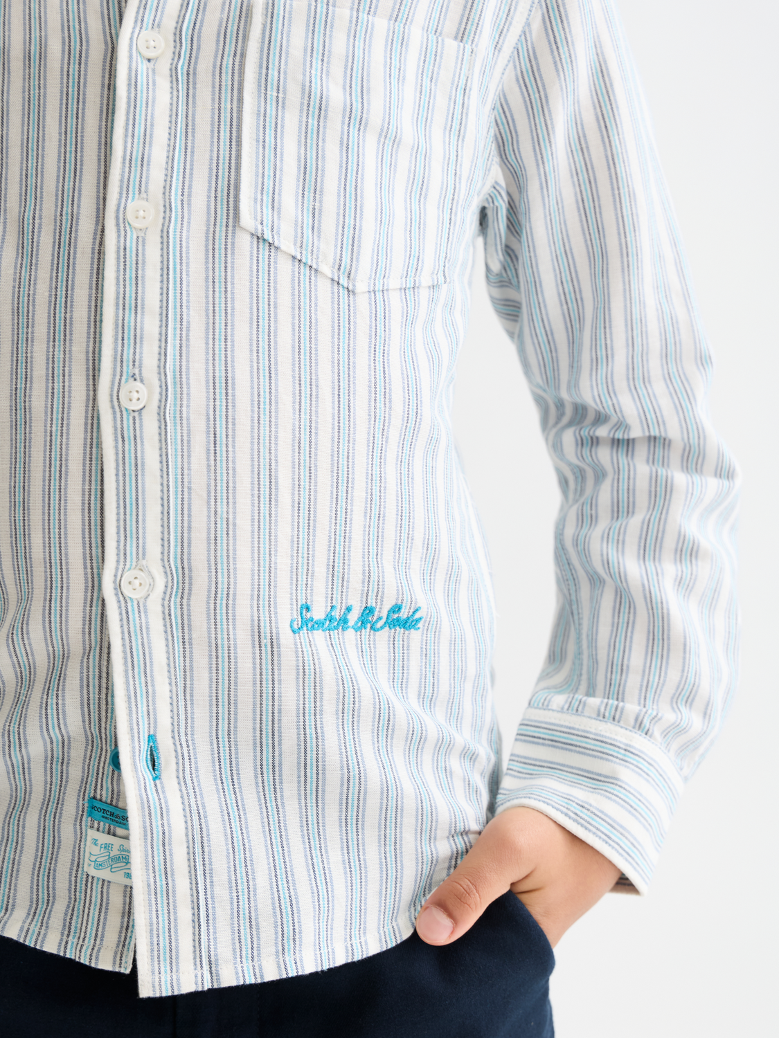 Kids striped linen long-sleeve shirt by Scotch & Soda, featuring a colorful striped pattern and classic collar.