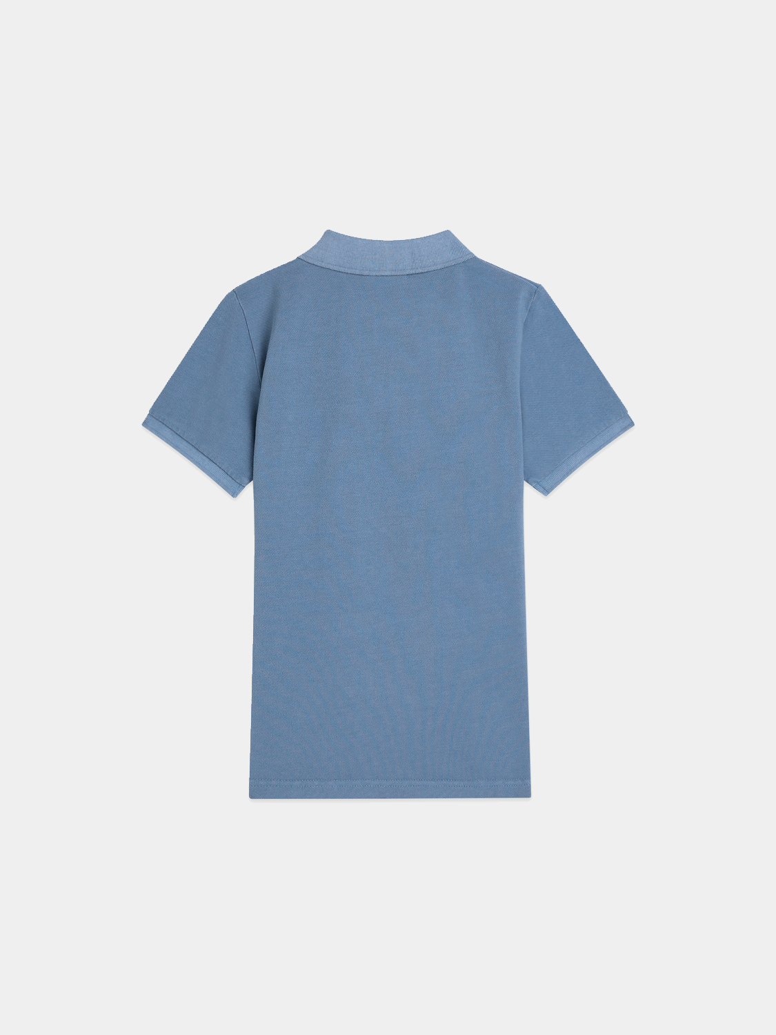 Kids' garment-dyed pique polo shirt by Scotch & Soda, featuring a classic collar and short sleeves, in navy blue.