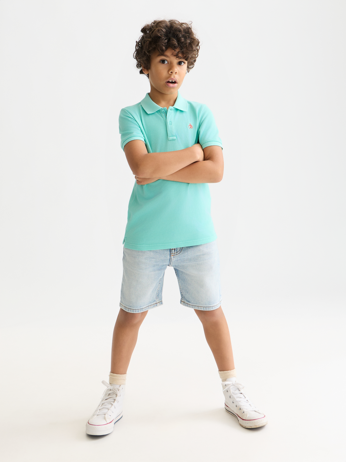 Kids garment-dyed pique polo shirt by Scotch & Soda, front view showing collar and short sleeves.