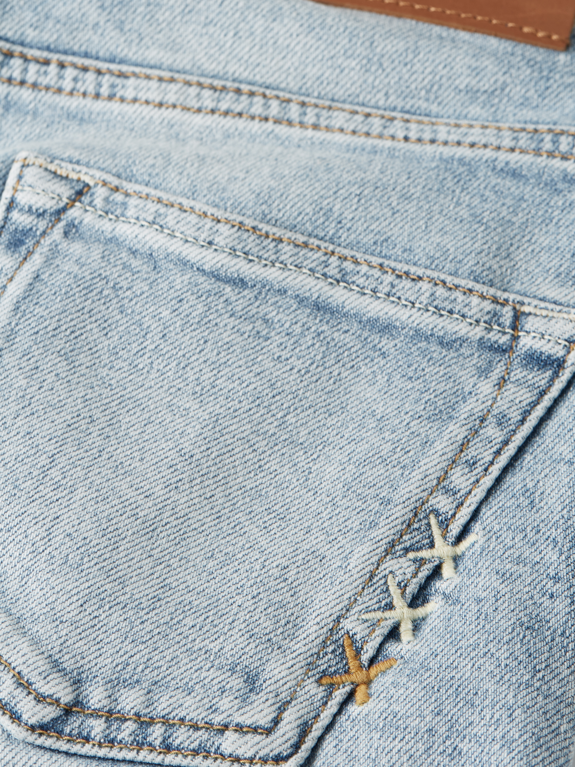 Kids' loose-fit denim jeans by Scotch & Soda, showing the casual fit, light wash, and classic five-pocket design.