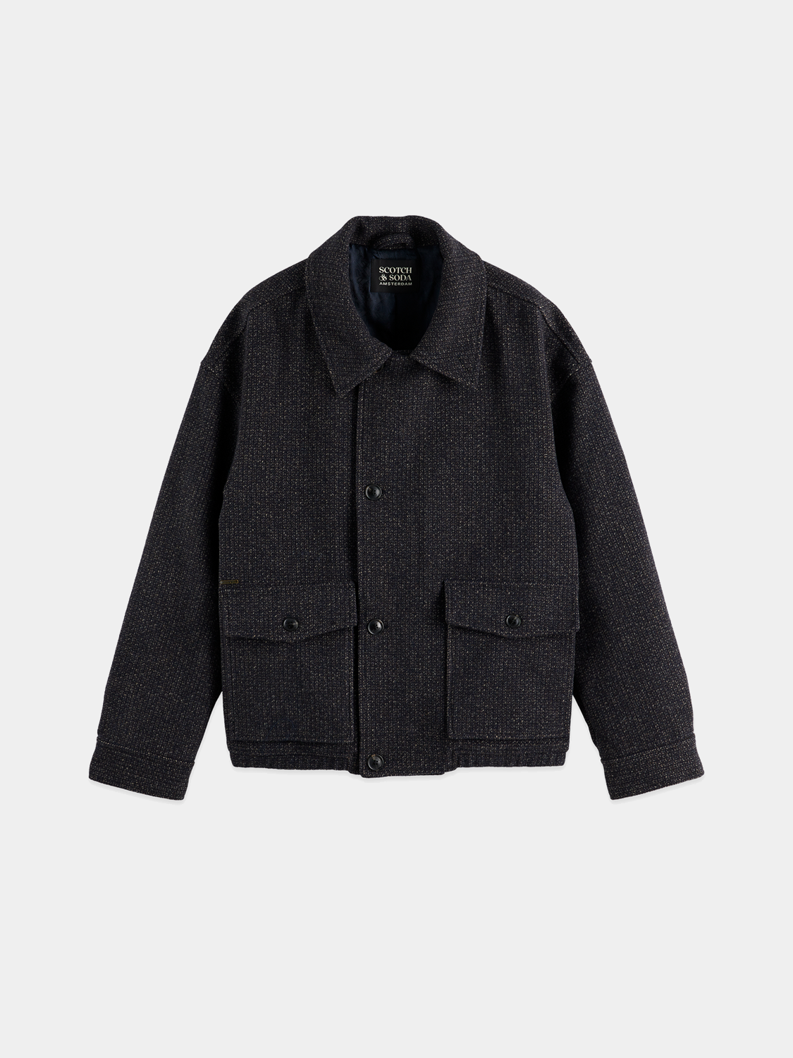 Textured SCOTCH & SODA jacket with a stylish design, shown on a hanger with visible fabric details and button closures.