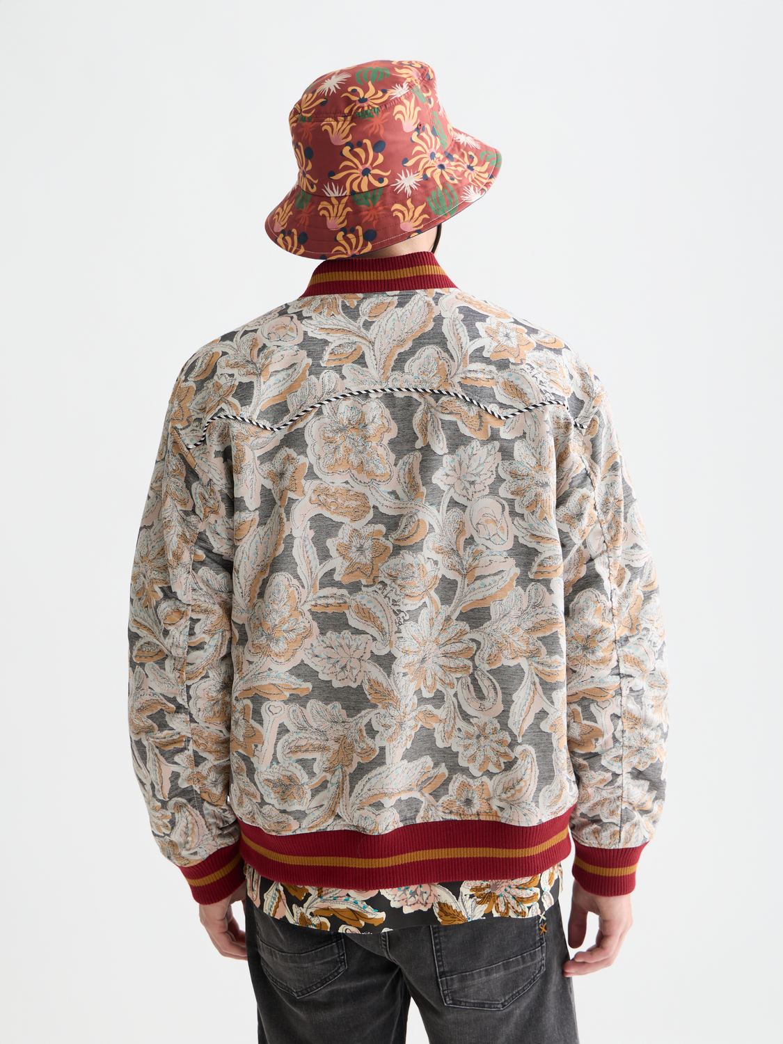 Scotch & Soda jacquard souvenir jacket with intricate woven patterns and a classic collar, back view.