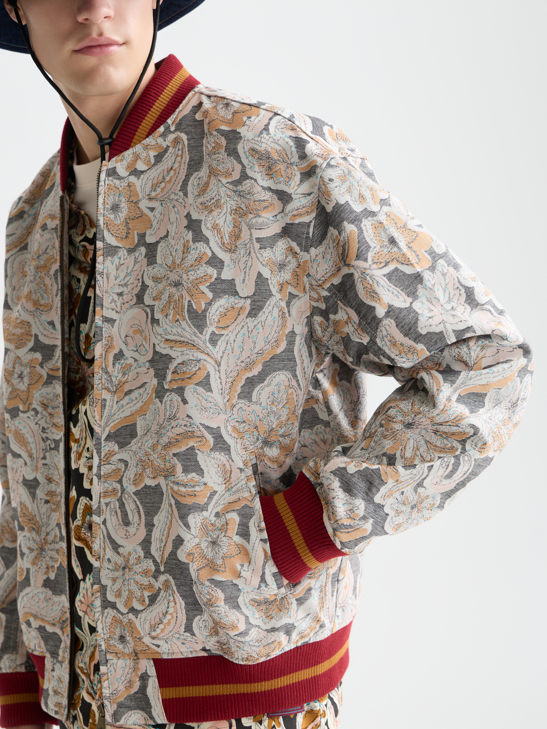 SCOTCH & SODA jacquard souvenir jacket with detailed pattern, featuring a classic collar, front buttons, and contrasting trim.