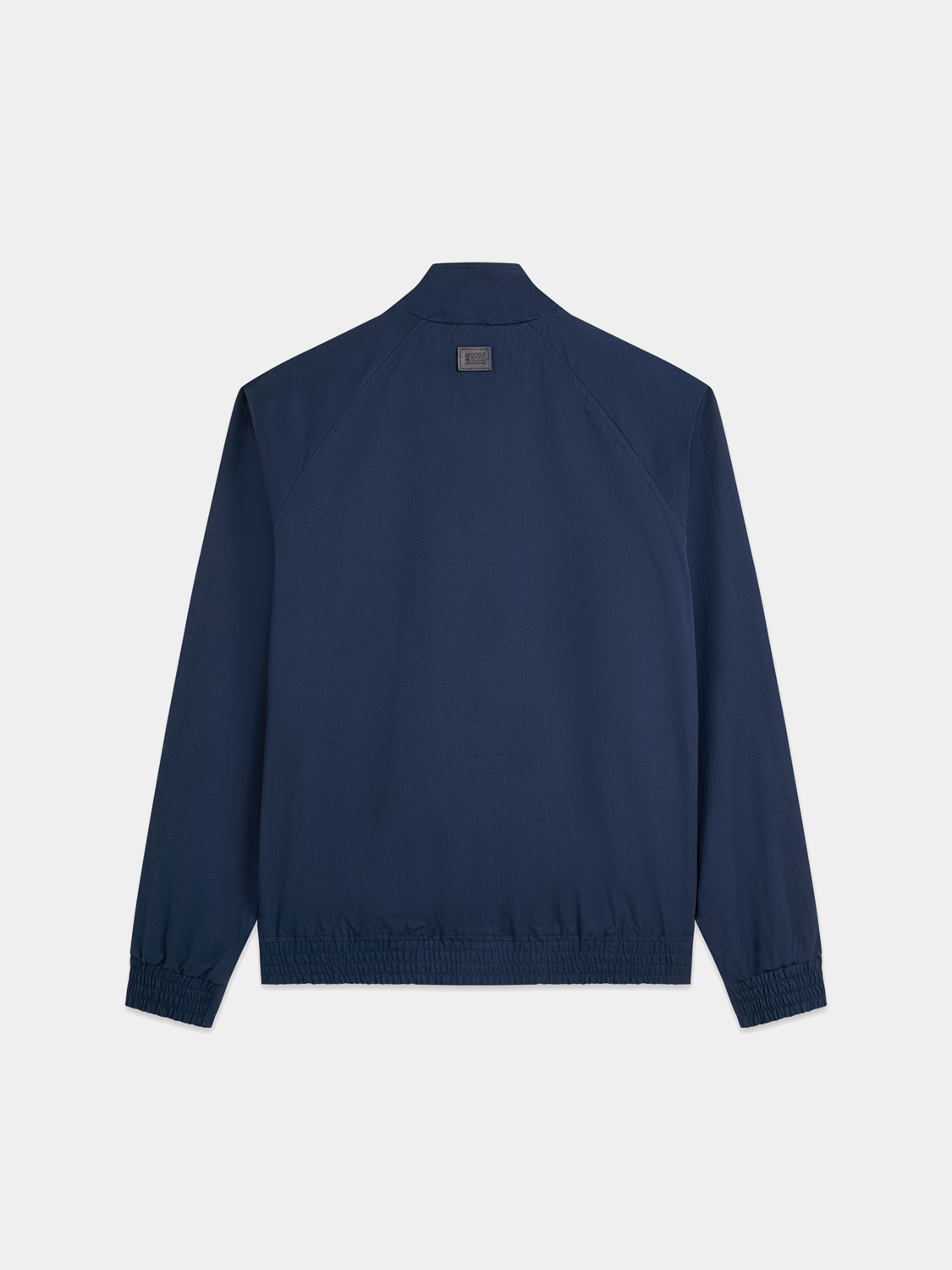 Reversible printed jacket by Scotch & Soda, showing both printed and solid sides, with a hood and zip closure.
