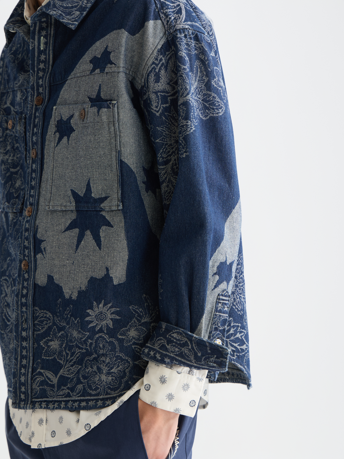 SCOTCH & SODA denim jacquard overshirt jacket with intricate pattern and button closure, styled on a mannequin.