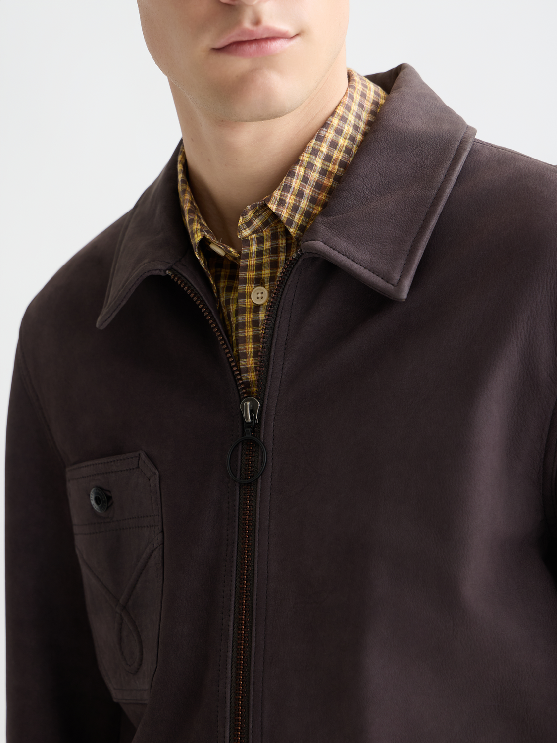 Brown suede leather jacket by Scotch & Soda featuring a classic fit and detailed stitching on a hanger.