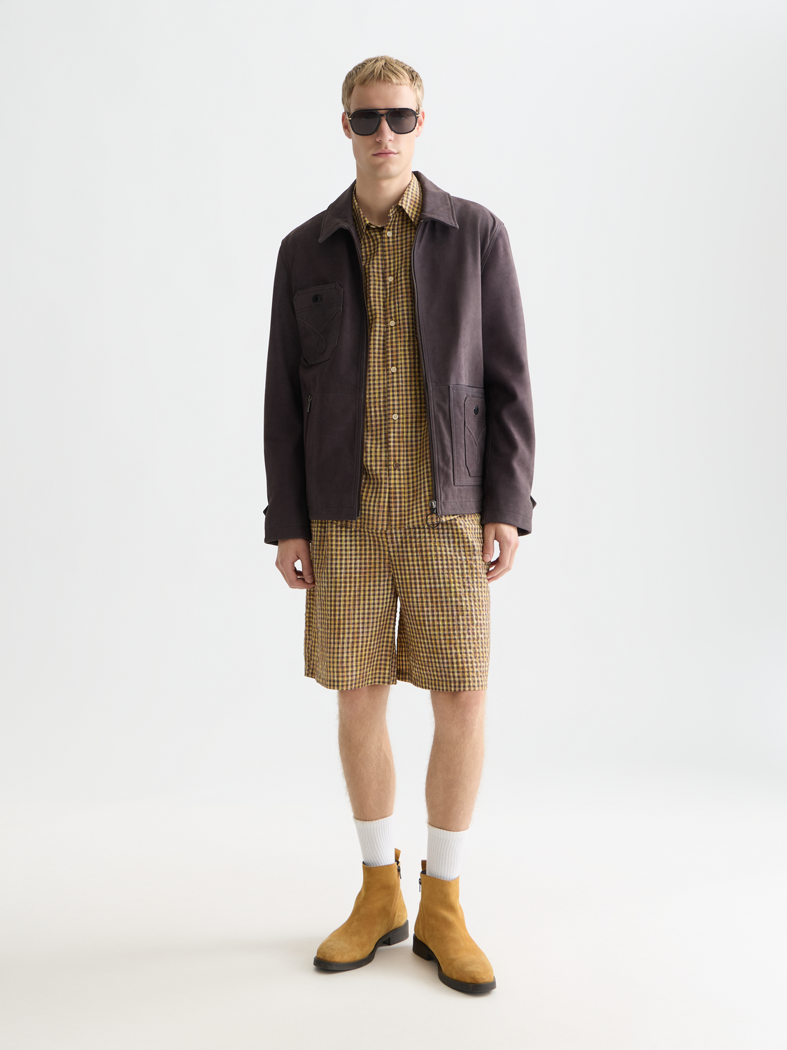 Scotch & Soda suede leather jacket in brown, featuring classic styling and a smooth texture, displayed on a hanger.