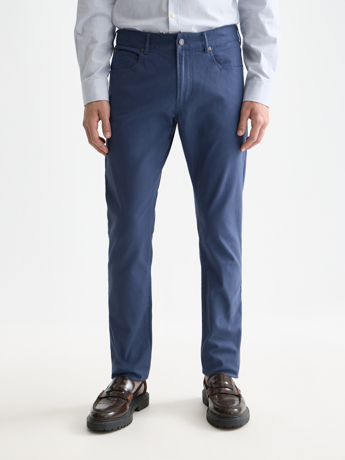 Slim-fit Ralston pants by Scotch & Soda, shown in dark fabric, with front view highlighting the tailored fit and clean design.