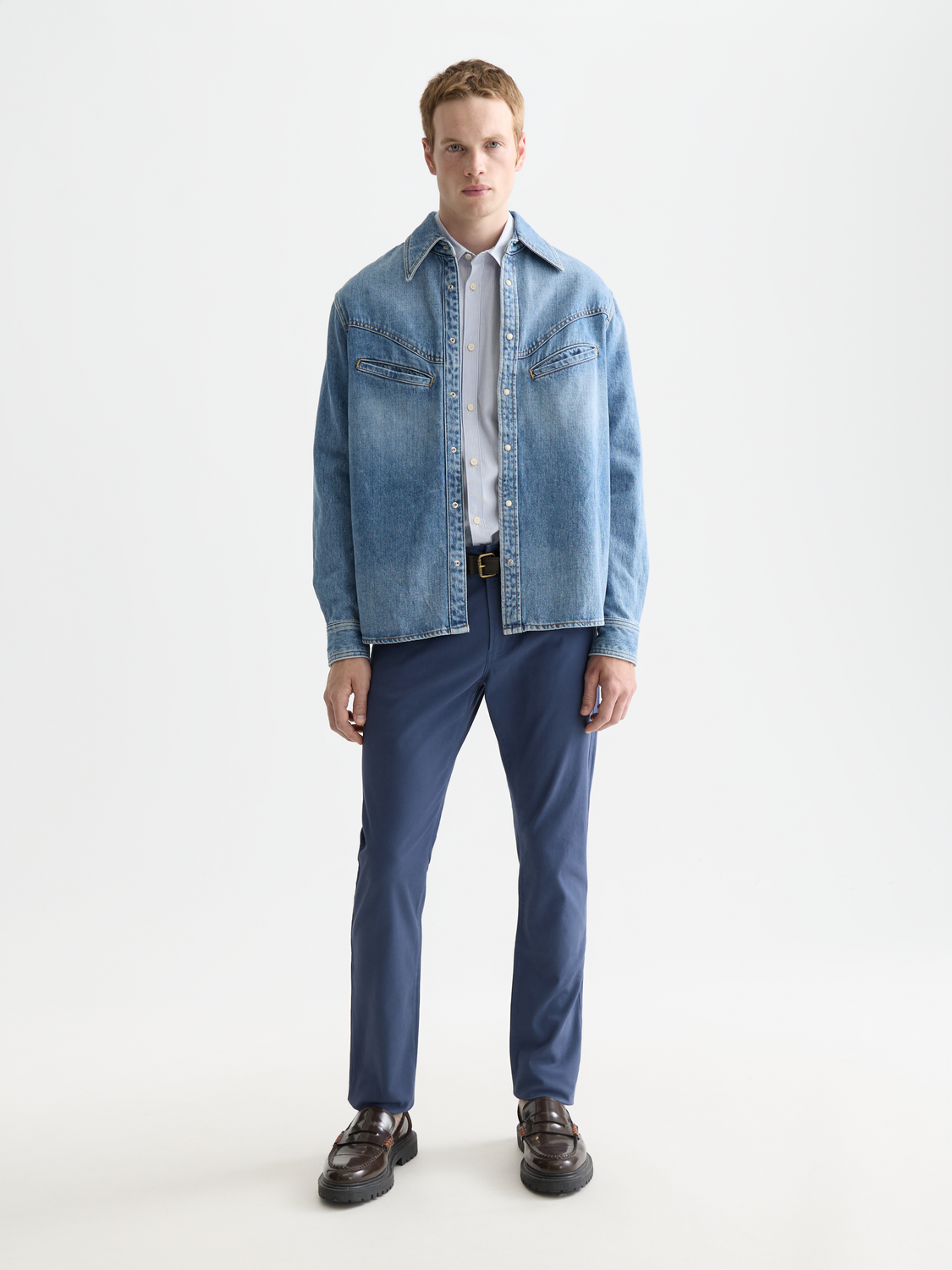 Scotch & Soda Ralston slim-fit pants in dark fabric, shown on a model, with a close-up of the waist and leg details.