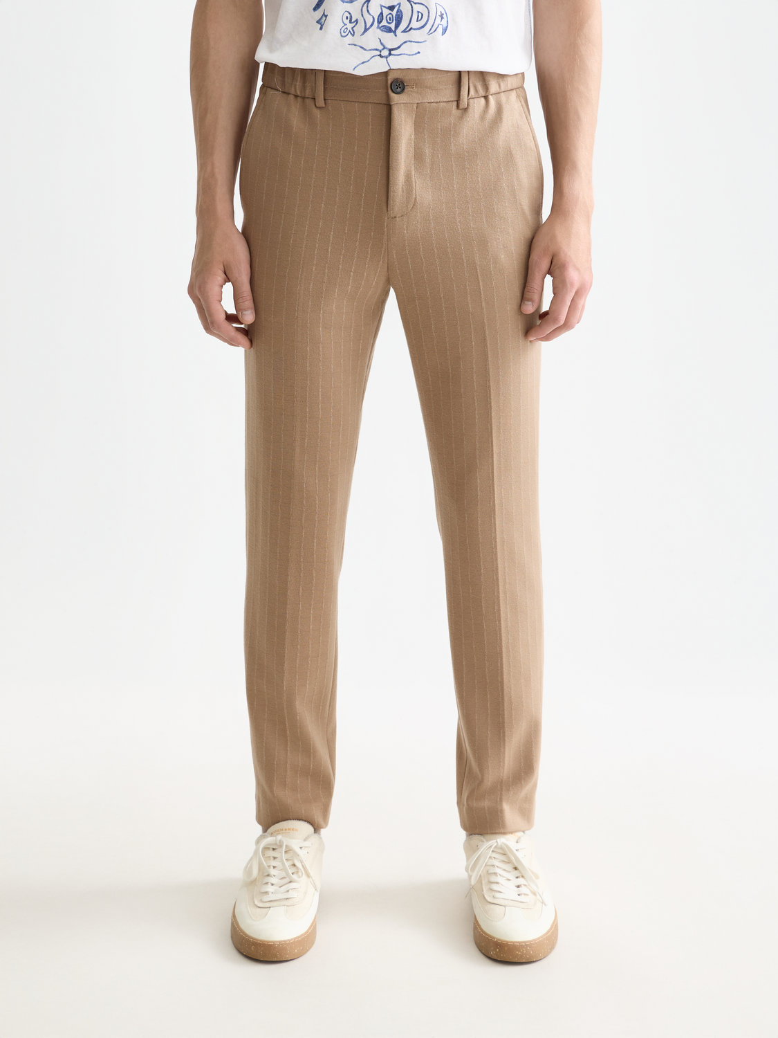 Scarlet tapered-fit pants by Scotch & Soda featuring a slim silhouette and tailored design, shown in a close-up view.