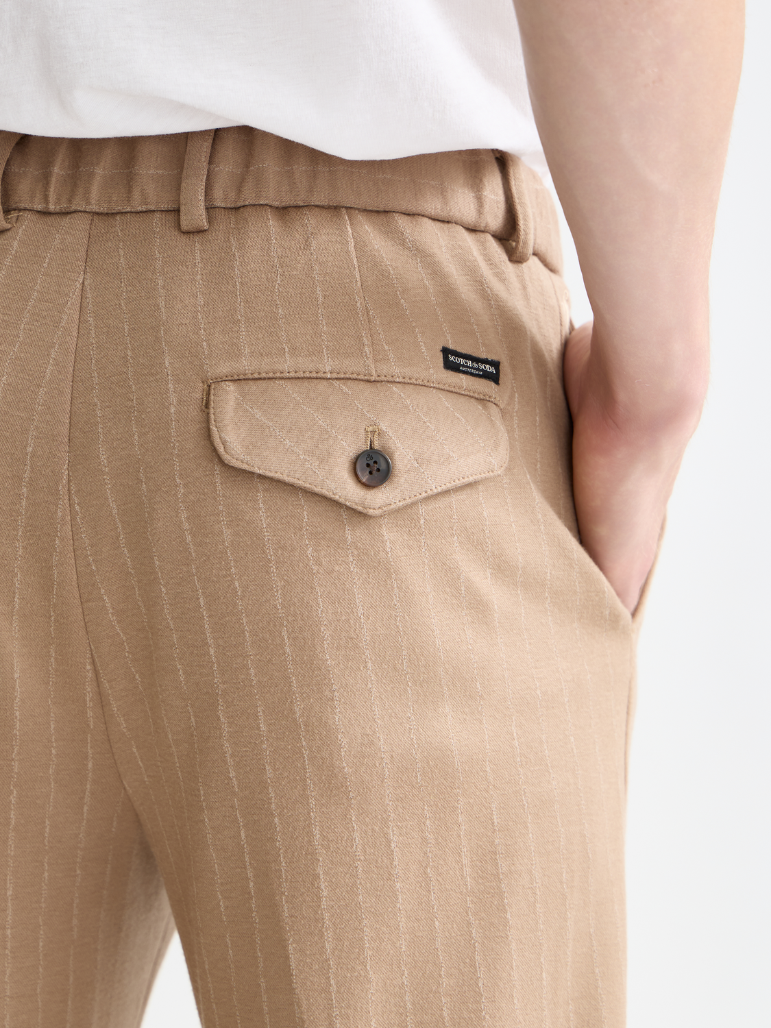 SCOTCH & SODA Finch tapered-fit pants in dark fabric, featuring a slim silhouette and classic design.
