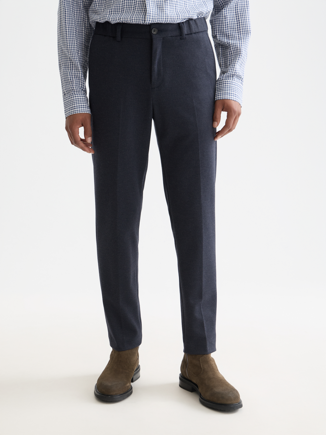 SCOTCH & SODA Finch tapered-fit pants in dark fabric, shown with a focus on the tailored design and slim silhouette.