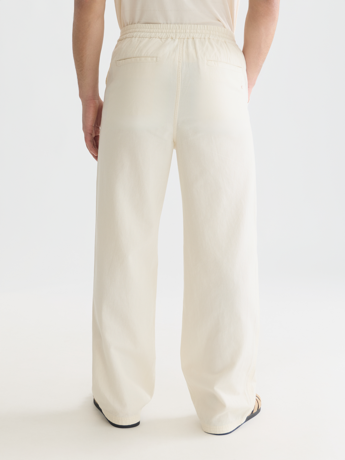 SCOTCH & SODA Otis straight-fit jogger pants in dark fabric, showing back view with tailored waistband and relaxed fit.