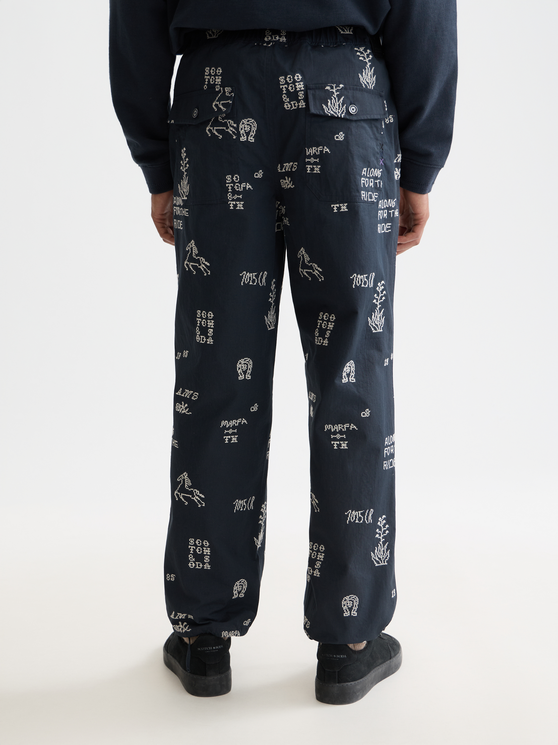 Embroidered Scotch & Soda chinos pants with detailed stitching, back view showcasing stylish design and tailored fit.