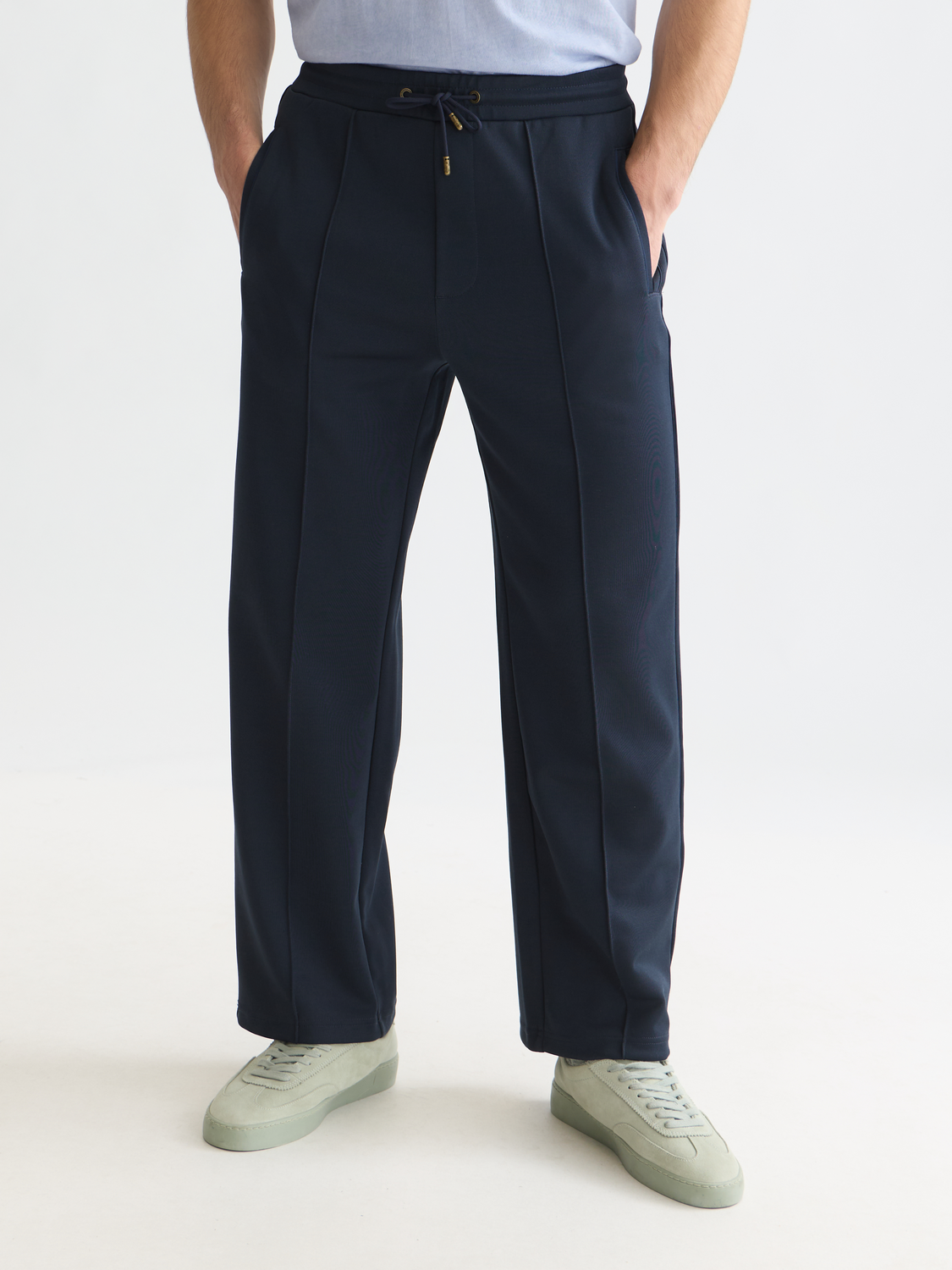 Scotch & Soda interlock sweatpants with a relaxed fit, featuring a drawstring waist and side pockets, in dark color.