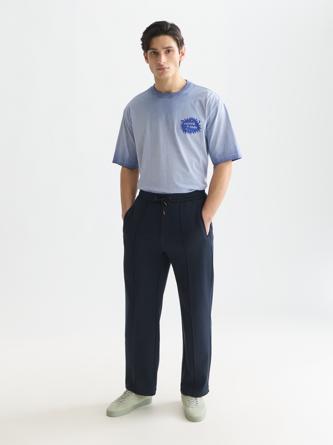 Scotch & Soda interlock trackpant sweatpants in black with side pockets and elastic waistband, casual athletic style.