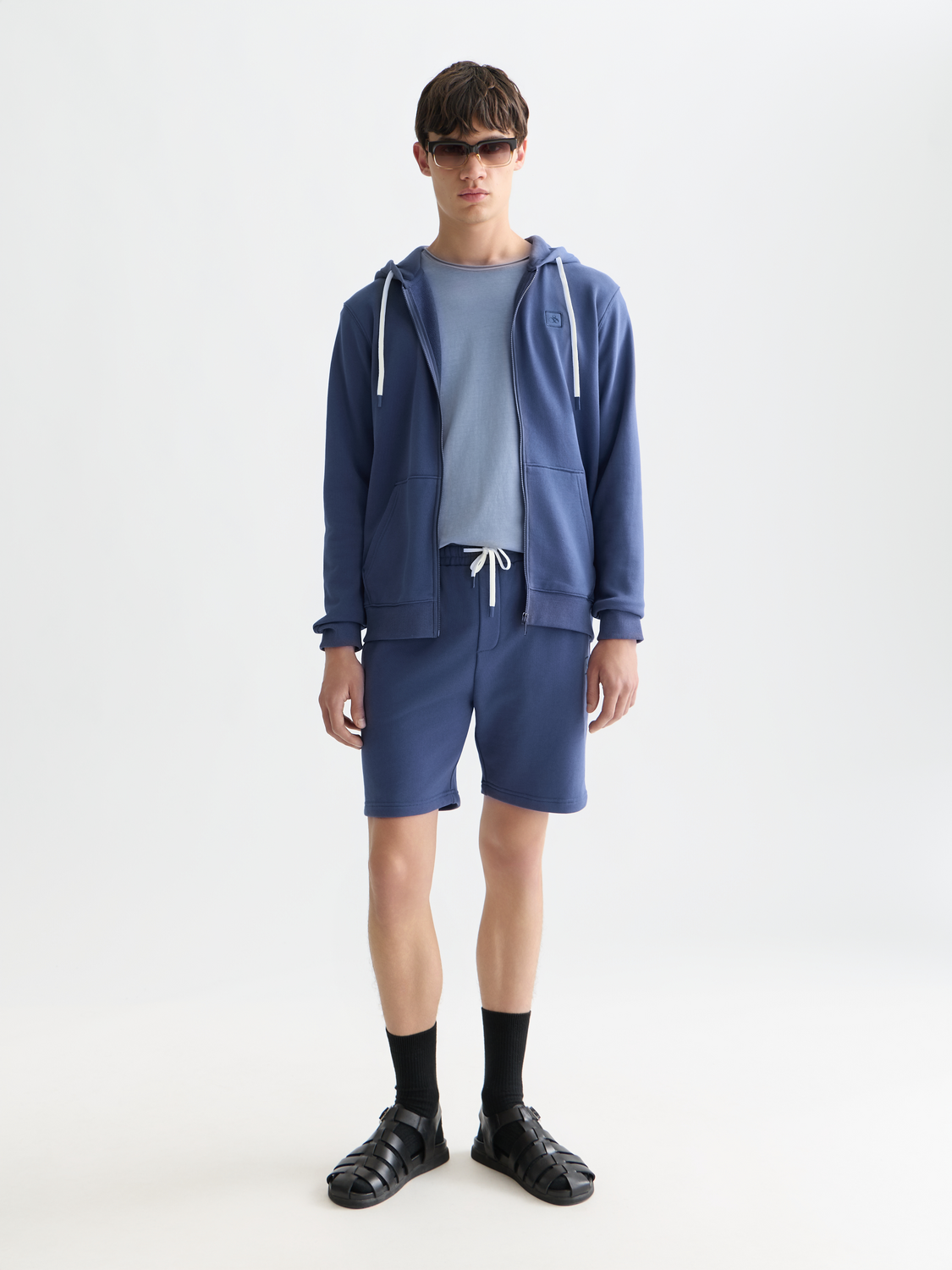Scotch & Soda logo badge sweatshorts featuring a casual fit, soft fabric, and branded logo patch on the front side.