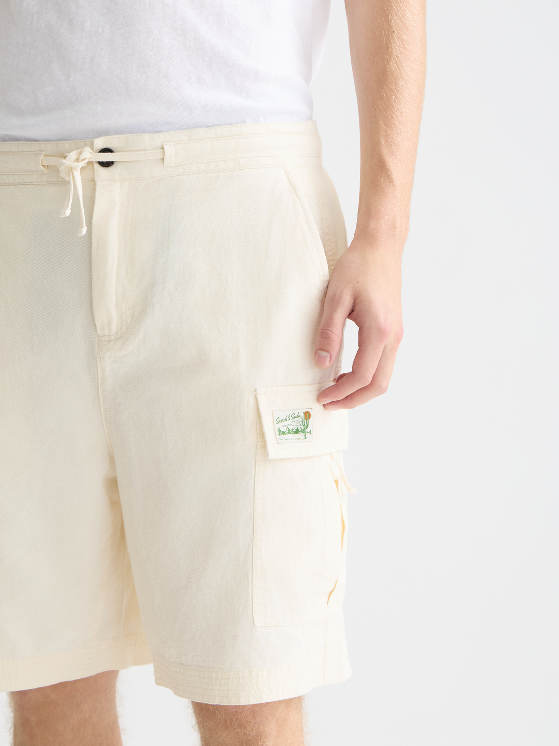 SCOTCH & SODA cargo linen shorts with multiple pockets, beige color, casual fit, and knee-length design.