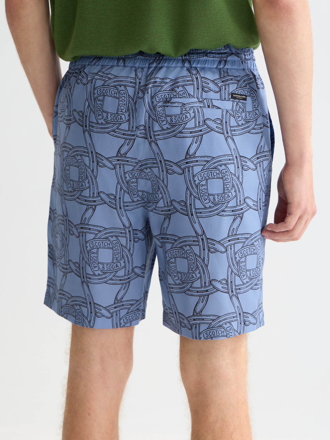Fave printed shorts by Scotch & Soda featuring colorful floral patterns and relaxed fit, shown on a model.