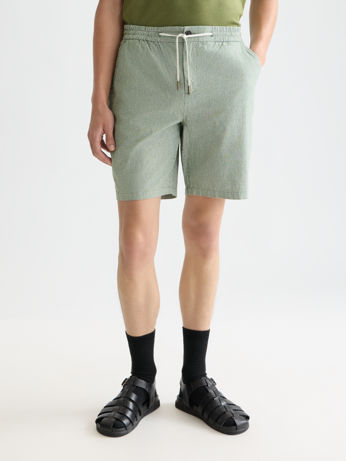 Scotch & Soda Fave cotton-linen shorts featuring a relaxed fit and neutral color, styled on a flat lay.