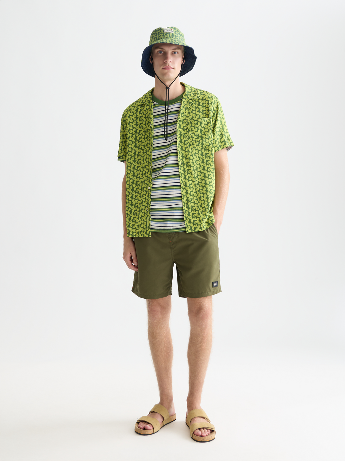 Mid-length SCOTCH & SODA swim shorts with a vibrant pattern, featuring a drawstring waist and side pockets, suitable for beachwear.