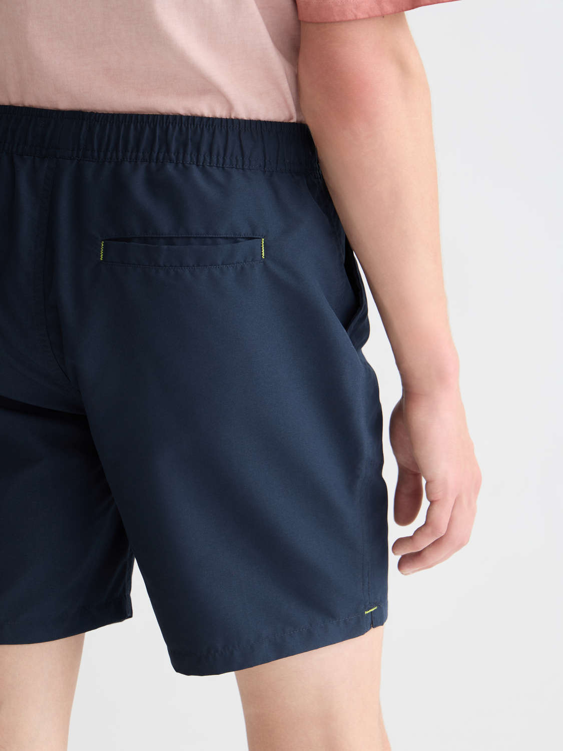 Mid-length SCOTCH & SODA swim shorts with a colorful pattern, displayed on a white background.