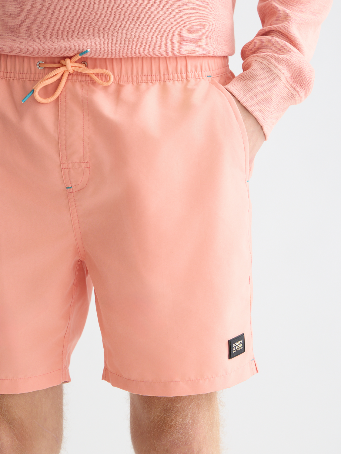 Mid-length Scotch & Soda swimshorts with a colorful pattern, designed for comfortable beach or poolside wear.