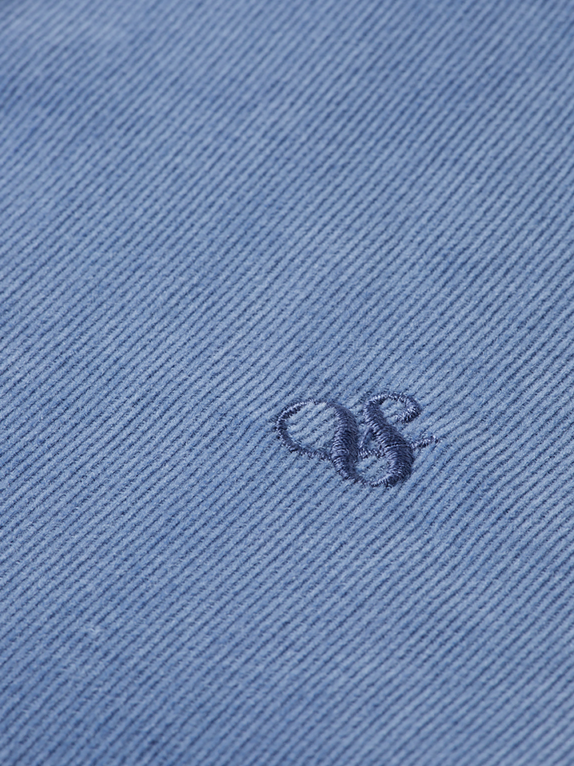 Lightweight navy corduroy long-sleeve shirt by Scotch & Soda, showing collar, button front, and textured fabric.