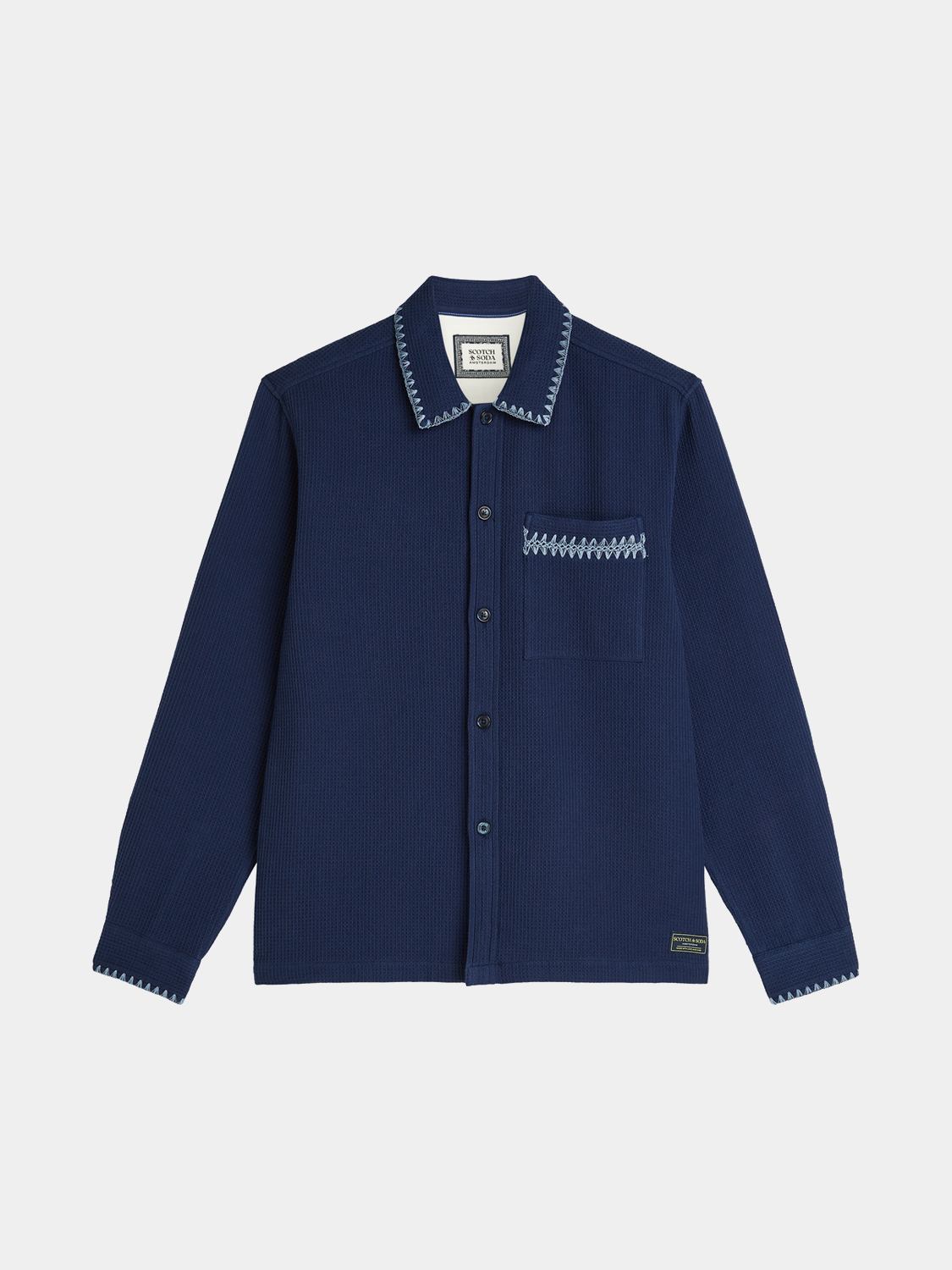 Long-sleeve Scotch & Soda waffle-structured shirt with a classic collar and button front, showcasing textured fabric and stylish fit.