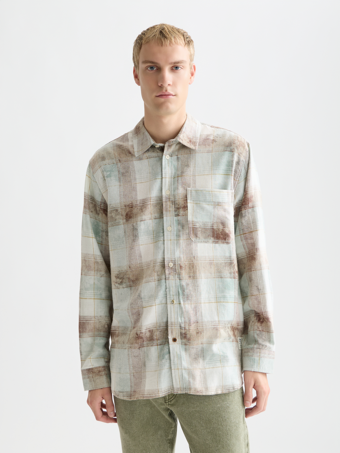 Long sleeve washed check shirt from Scotch & Soda featuring a classic plaid pattern and button-up front.