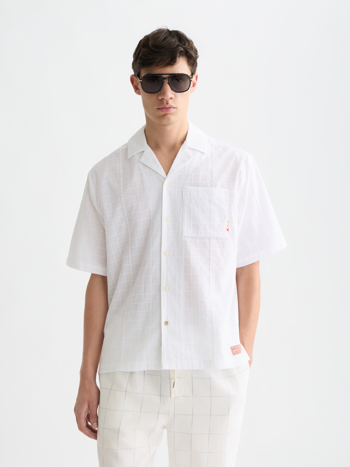 Embroidered short-sleeved SCOTCH & SODA shirt with detailed embroidery on light fabric, casual summer style.