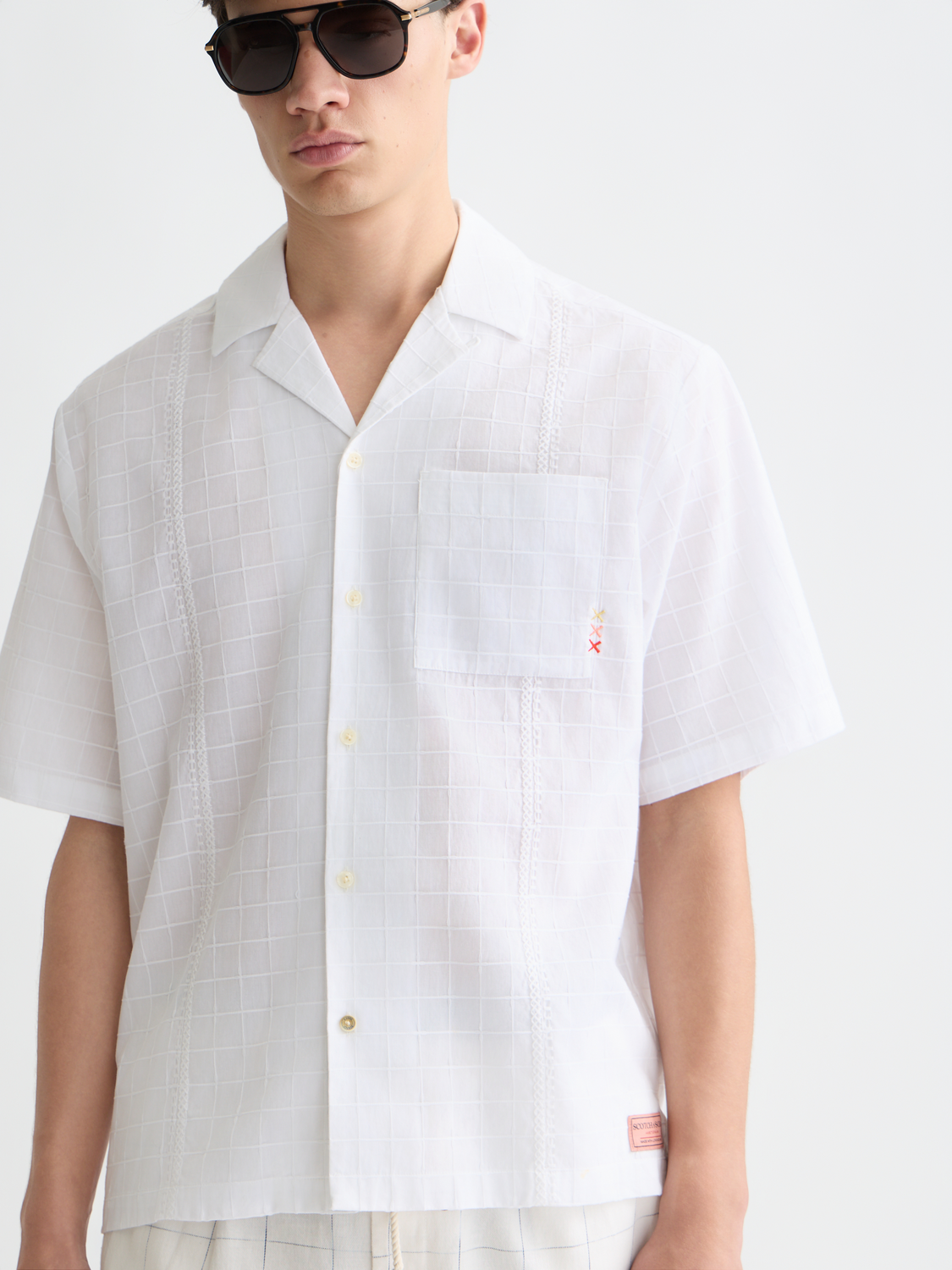 Embroidered SCOTCH & SODA short-sleeved shirt with floral patterns, casual fit, lightweight fabric, and button front.