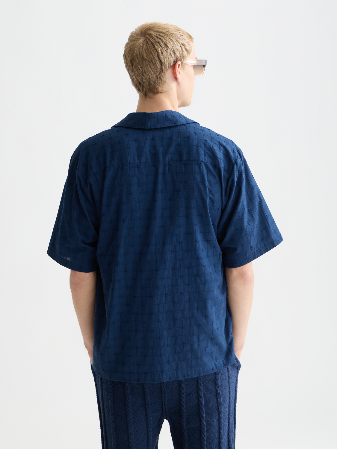 Embroidered short-sleeved shirt by Scotch & Soda featuring floral embroidery and a relaxed fit, viewed from the back.