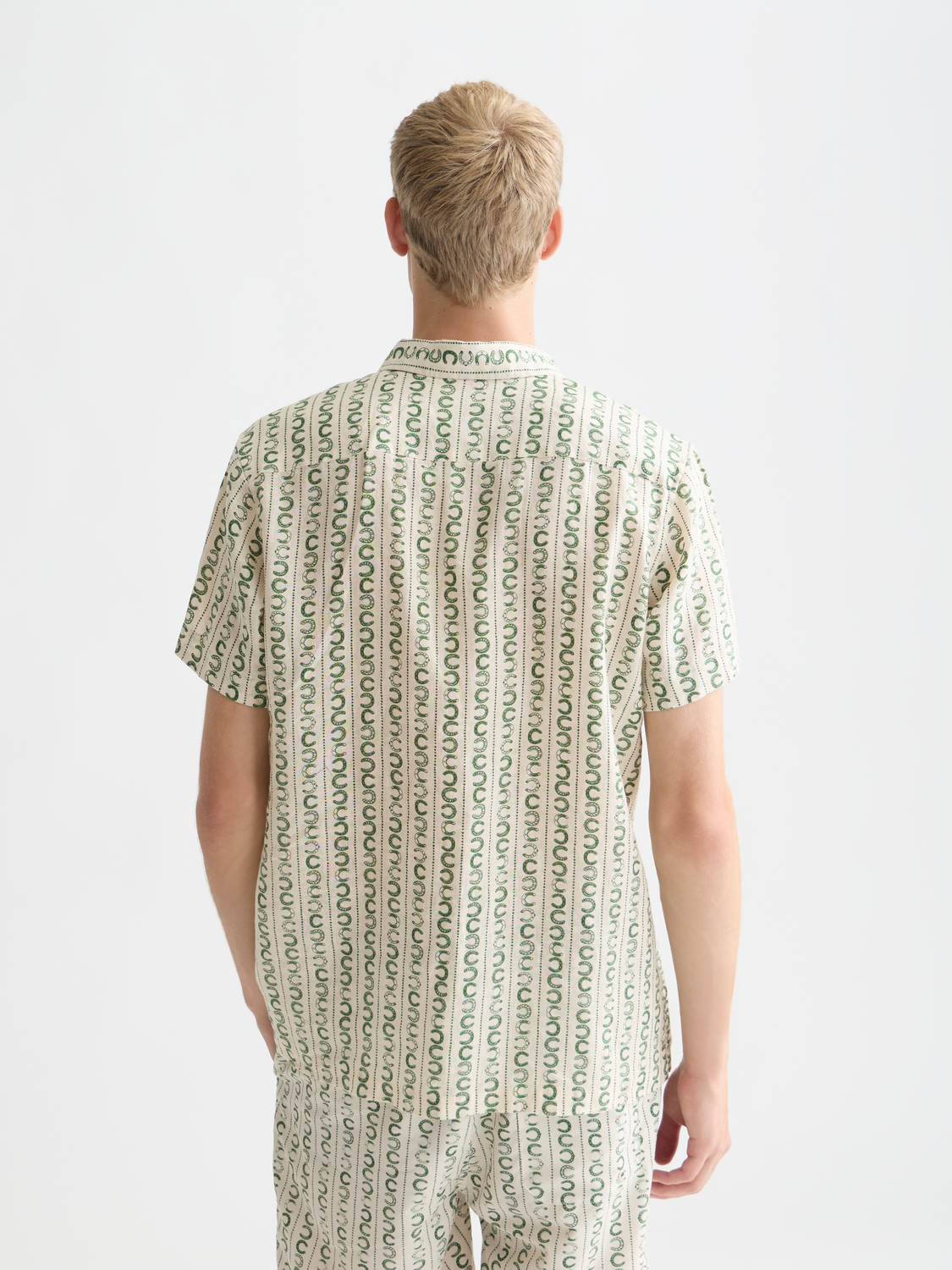 Printed short-sleeved linen shirt from Scotch & Soda, shown from the back with a relaxed fit and stylish pattern.