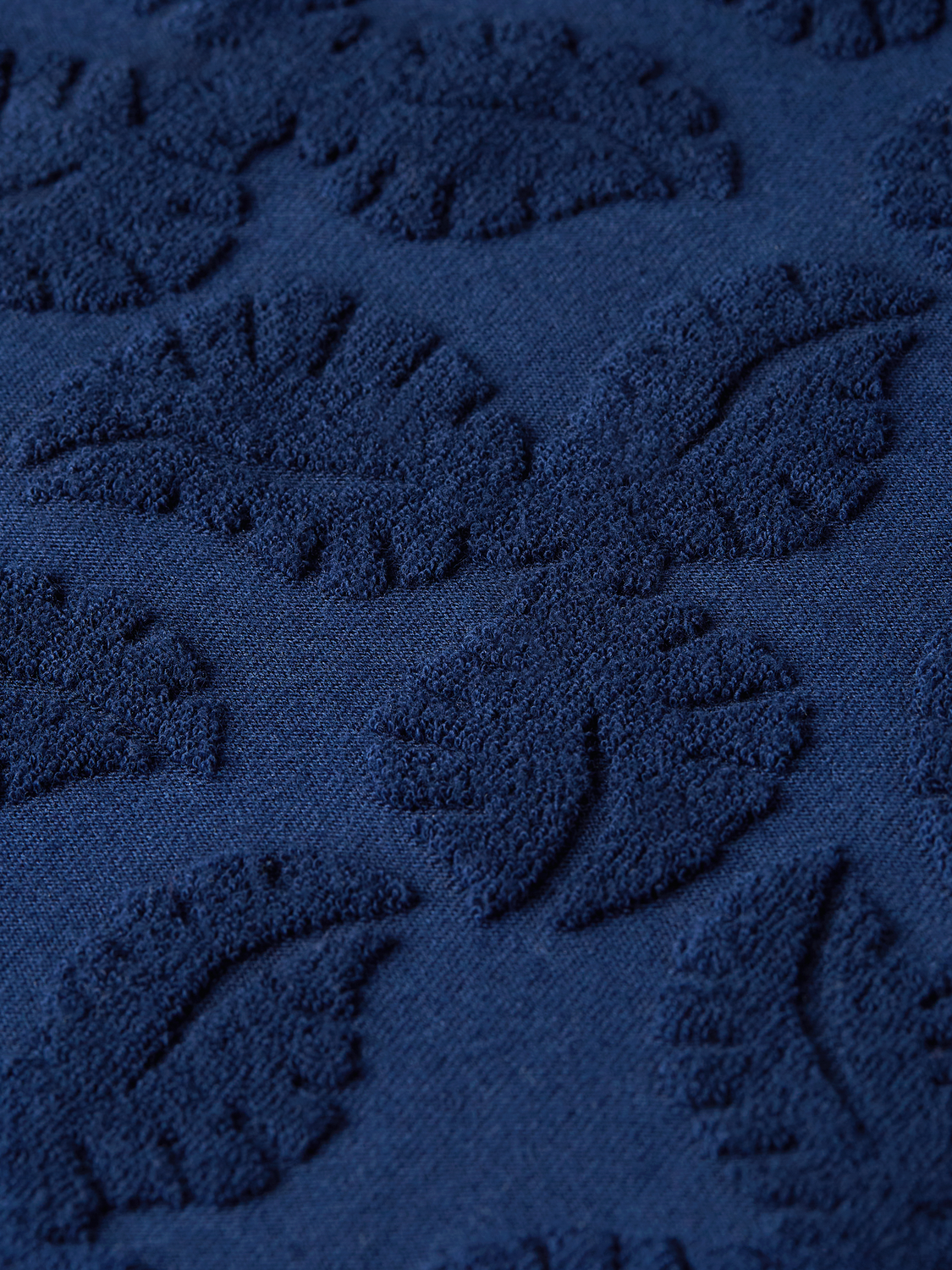 Scotch & Soda men's terry jacquard short-sleeved shirt with a textured pattern and classic collar, displayed flat.