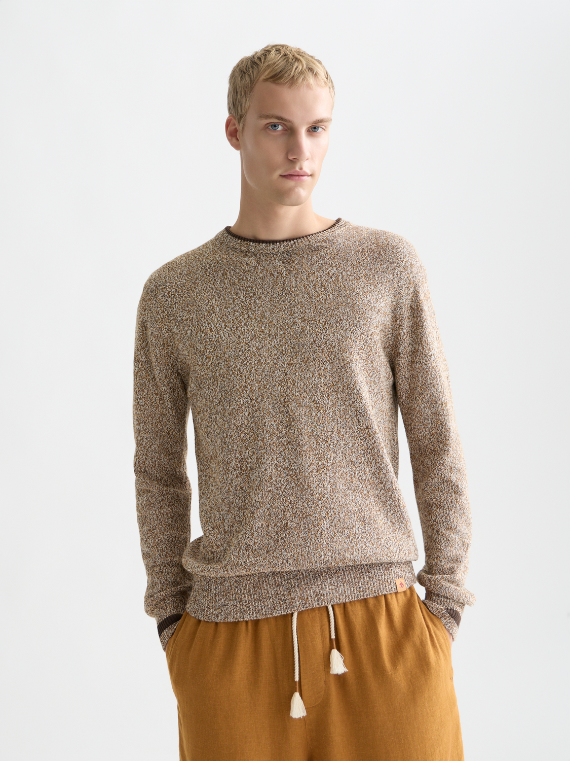 Close-up of a Scotch & Soda melange knitwear pullover with a textured knit pattern and soft fabric in a casual style.