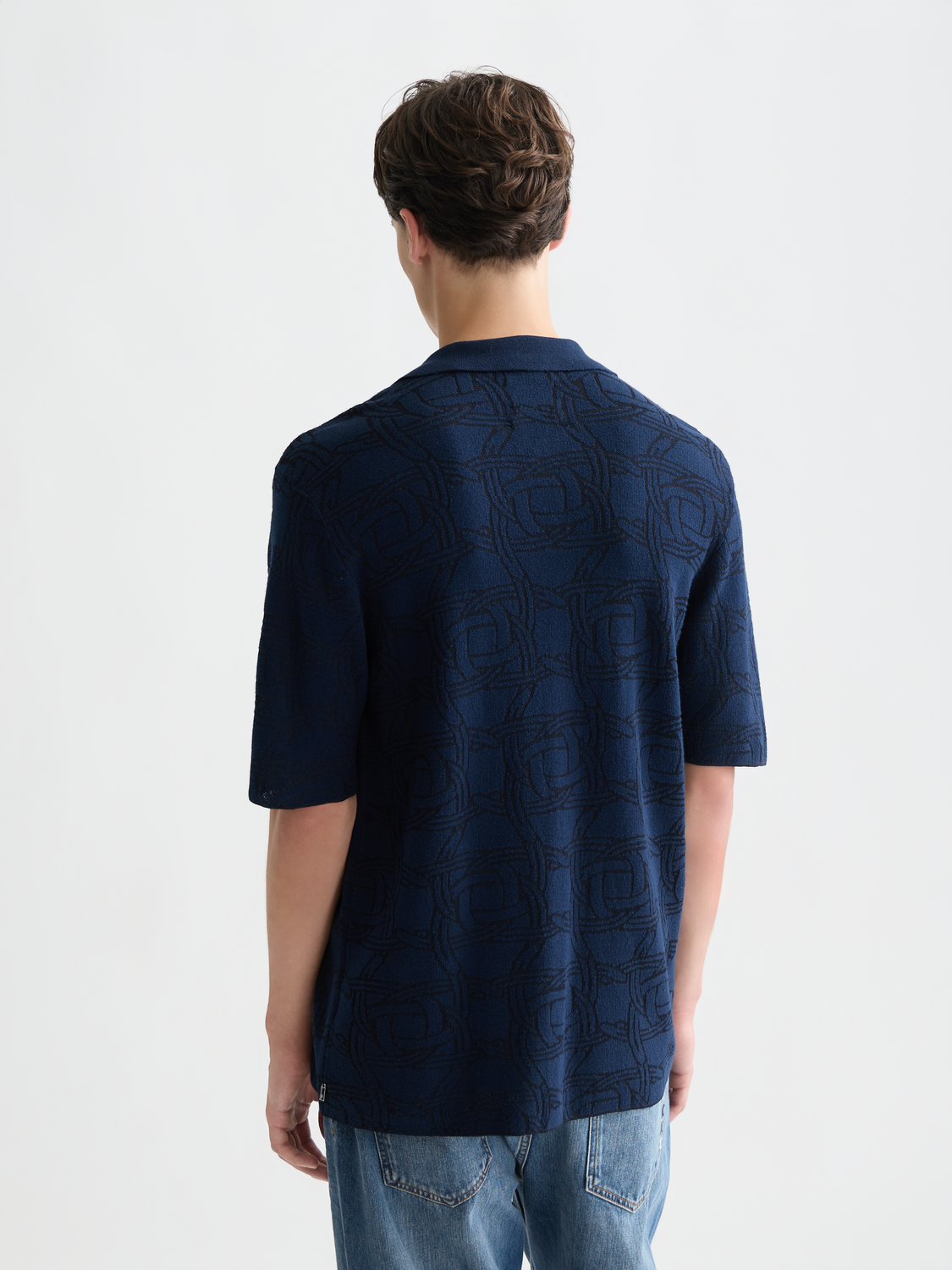 Knitted jacquard short-sleeved shirt by Scotch & Soda, featuring intricate knit pattern and short sleeves, front view.