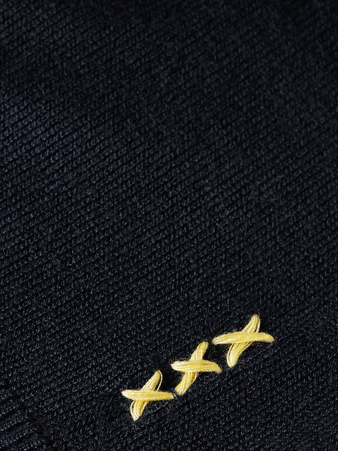 Knitted SCOTCH & SODA t-shirt in soft knitwear with a relaxed fit, displayed on a hanger against a neutral background.