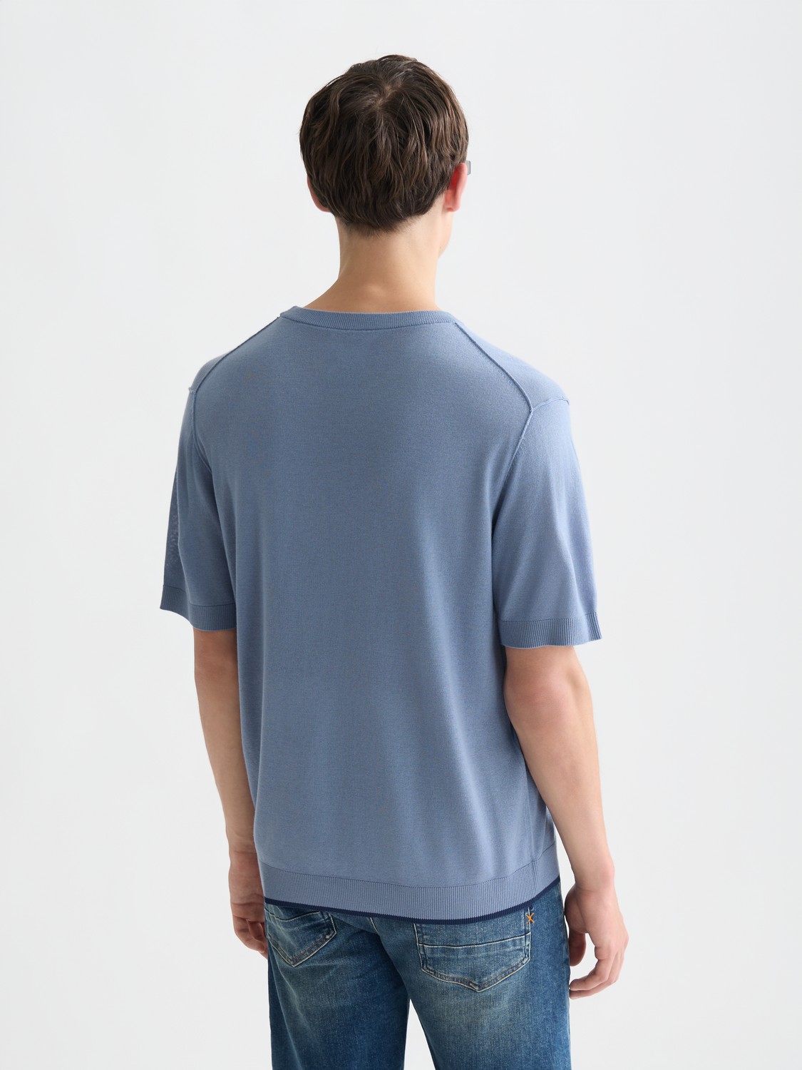 Knitted T-shirt from Scotch & Soda, featuring a textured knit fabric and casual fit, shown from the back view.