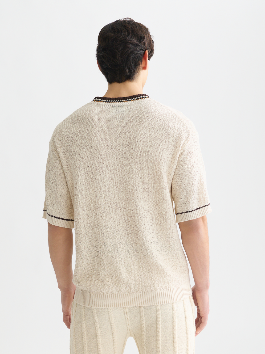 Knitted T-shirt by Scotch & Soda, showcasing a stylish knitwear design with a textured pattern and back view.