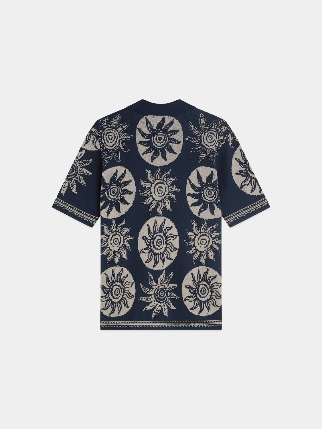 Dark blue SCOTCH & SODA knitted jacquard short-sleeved shirt with intricate pattern, close-up of textured knit fabric.