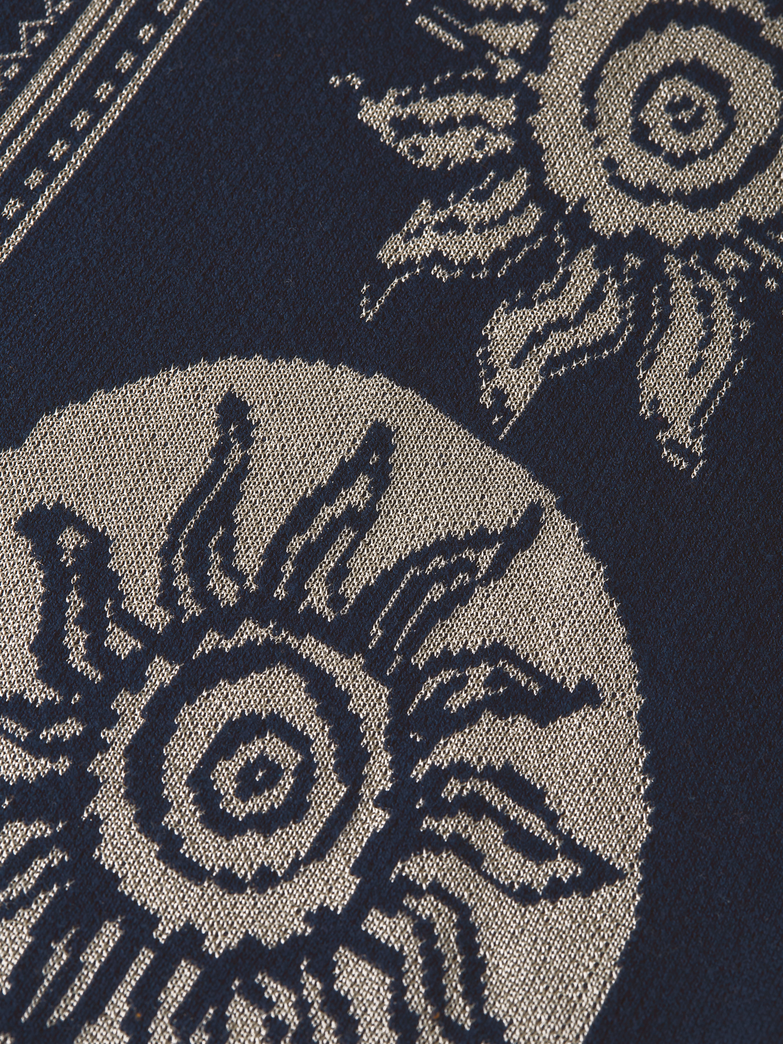 Knitted jacquard short-sleeved shirt from SCOTCH & SODA, featuring intricate pattern and soft knit fabric.
