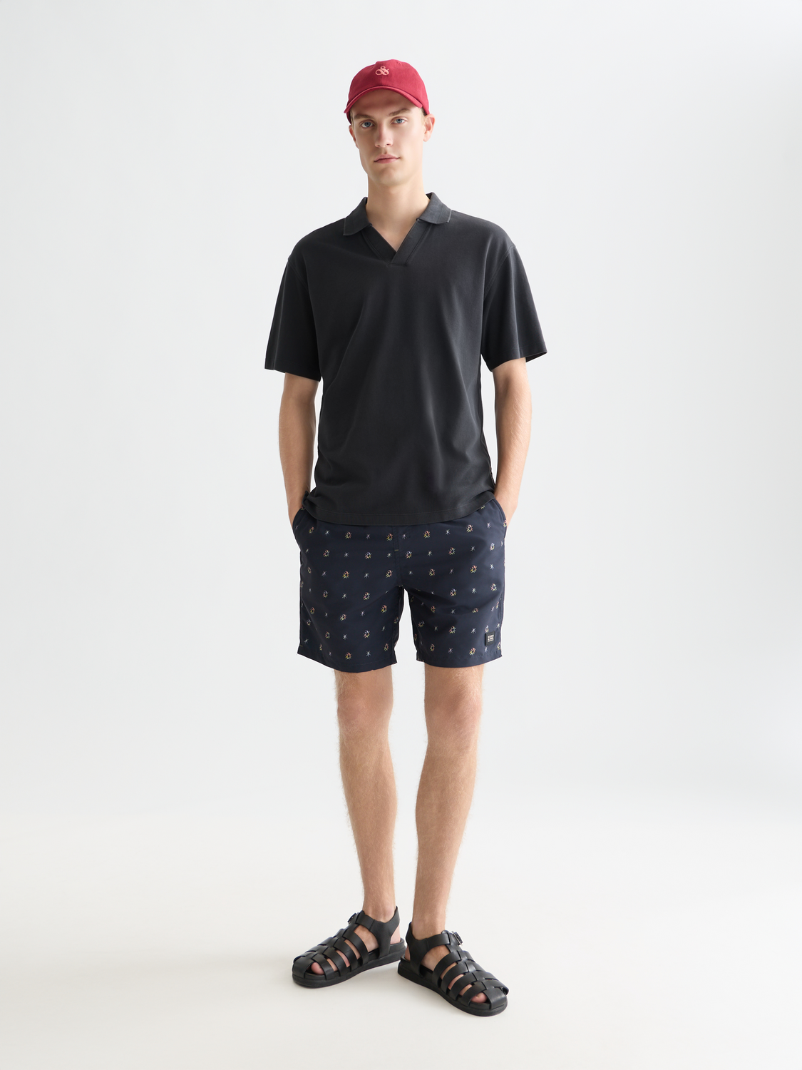 Navy Scotch & Soda pique polo shirt with a classic collar and short sleeves, displayed on a neutral background.