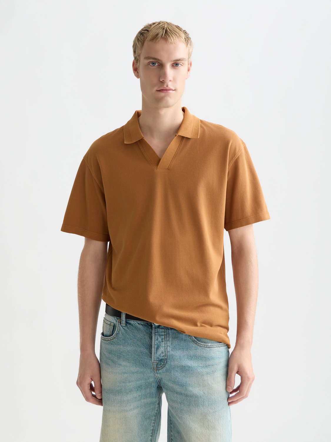 Navy Scotch & Soda pique polo shirt with a classic collar and short sleeves, displayed flat against a white background.