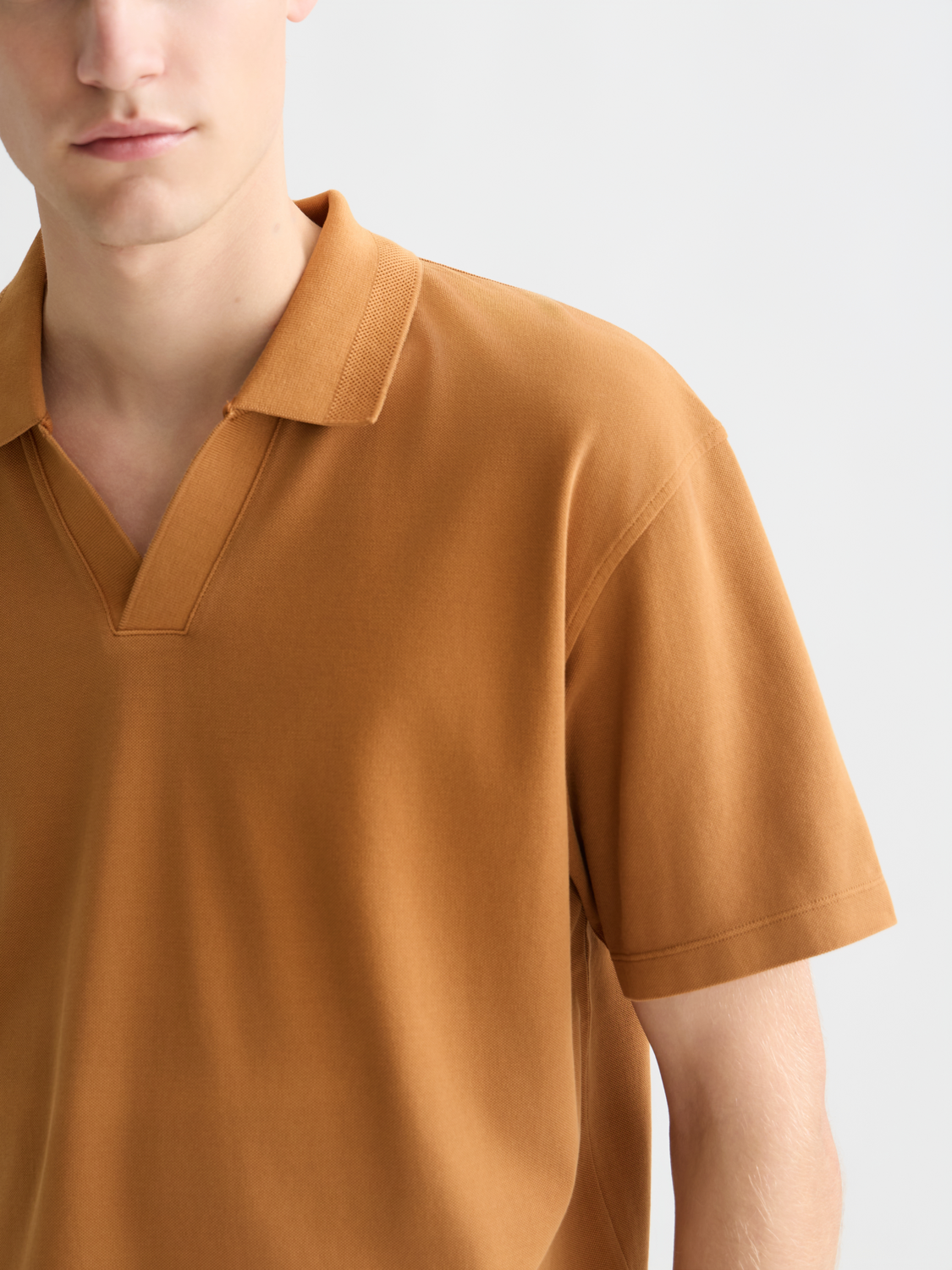 Blue Scotch & Soda pique polo shirt with a classic collar and short sleeves, displayed on a plain background.
