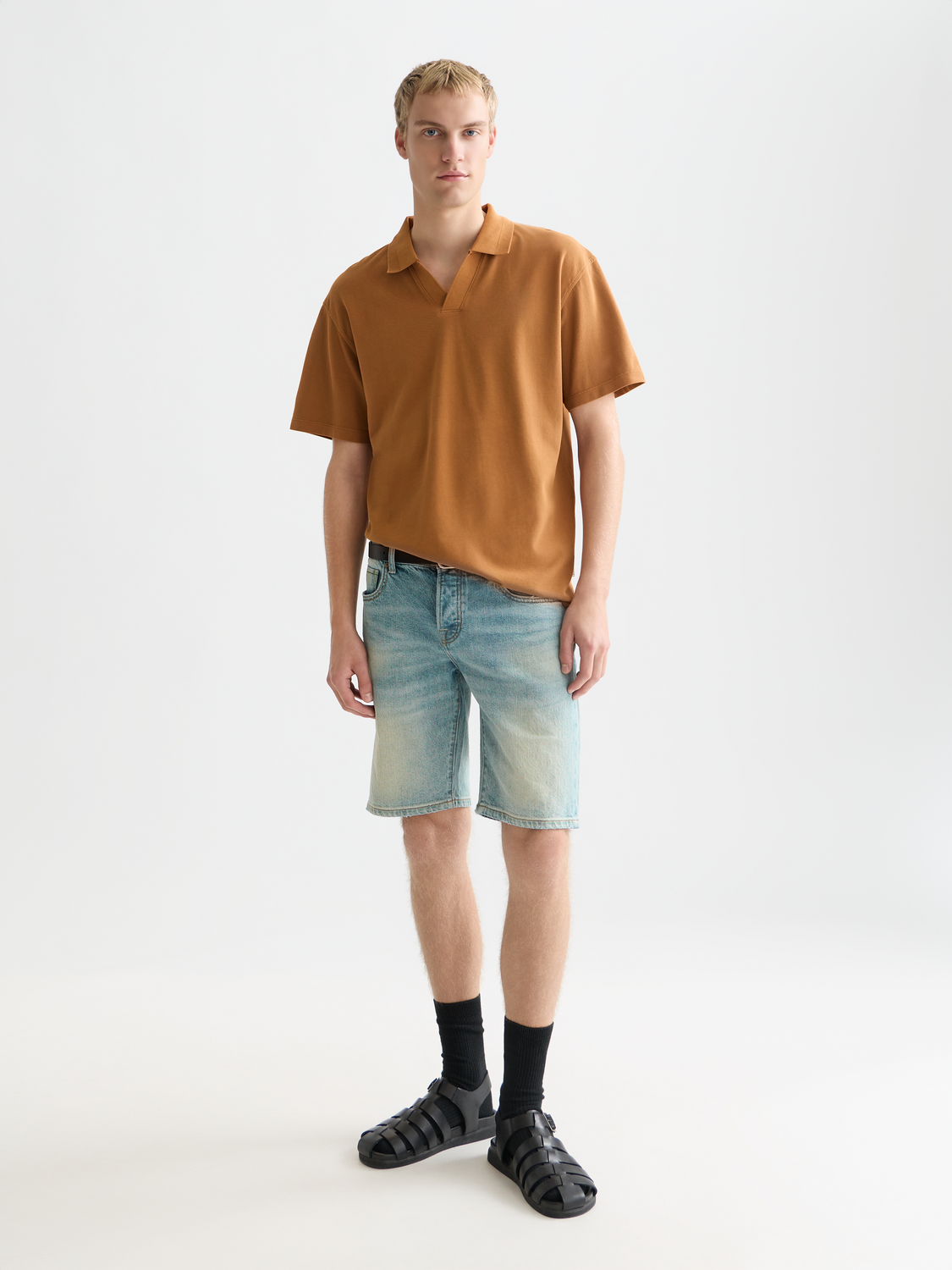 Navy Scotch & Soda pique polo shirt with a classic collar and short sleeves, displayed on a white background.